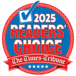 A circular badge with a checkmark and text reading 2025 Readers Choice and The Times-Tribune on a red ribbon, with blue, red, and white colors and star decorations.